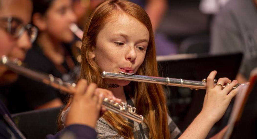 a music camp student playing the flute